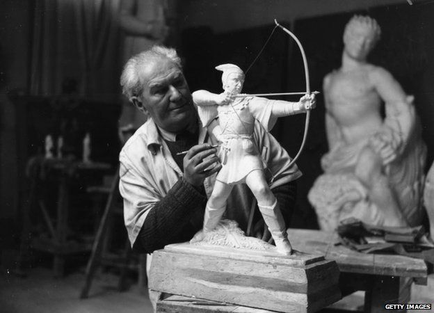 Artist James Woodford working on a sculpture of Robin Hood