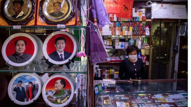 A souvenir show with plates on display with the picture of Chinese President Xi Jinping and the late Communist Party leader Mao Zedong.