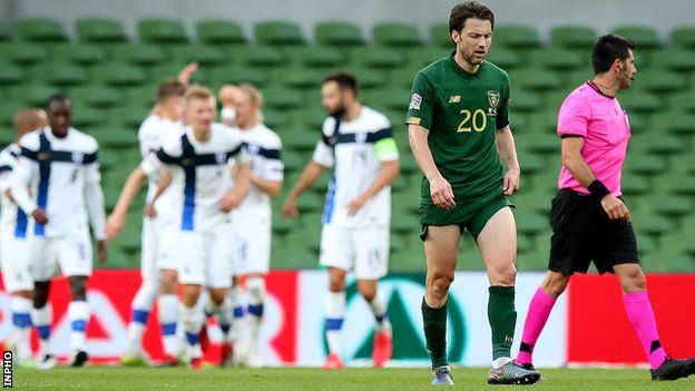 Harry Arter shows his disappointment as the Finland players celebrate their goal in Dublin