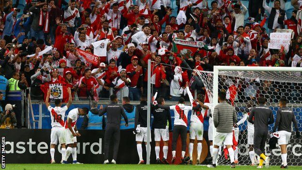 Peru celebrate with their fans at the final whistle