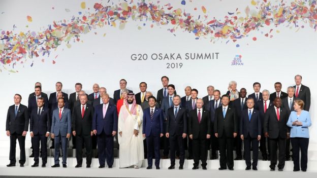 World leaders pose during the Leaders family photograph at the G20 leaders summit in Osaka