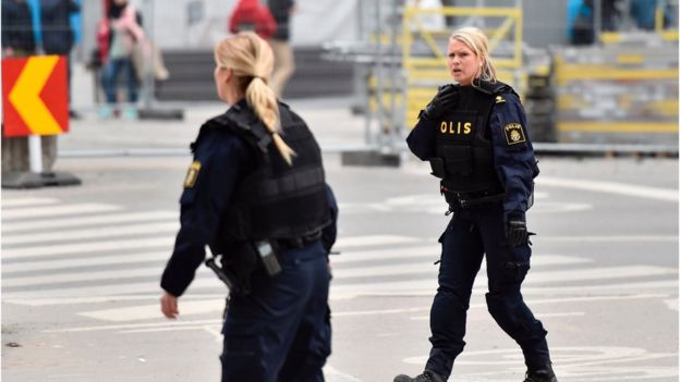 Swedish police work on the scene