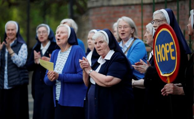 Nuns react at the St Anthony"s convent of Mercy Tunstall during the Clap for our Carers campaign in support of the NHS, following the outbreak of the coronavirus disease (COVID-19), in Sunderland, Britain