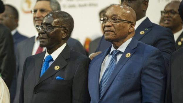 South African President Jacob Zuma (2nd R), African Union chairperson and Zimbabwean President Robert Mugabe (C)