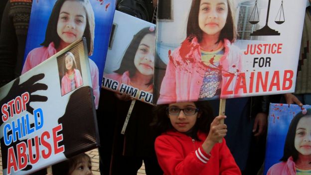 A girl holds a sign as she chants slogans with others to condemn the rape and killing of Zainab Ansari in Kasur, during a protest in Lahore, Pakistan on 14 January 2018