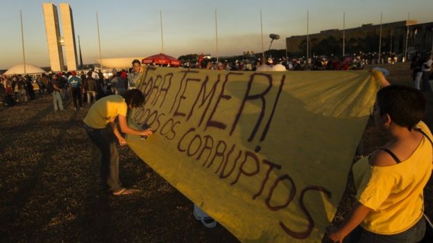 Demonstrators protest against President Temer outside the Congress building during the vote on the corruption process against the head of state, in Brasilia, Brazil, 02 August 2017.