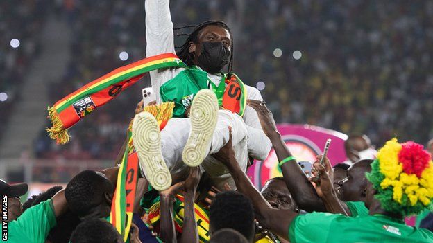 Aliou Cissé is hoisted aloft by Senegal's squad after winning the Africa Cup of Nations