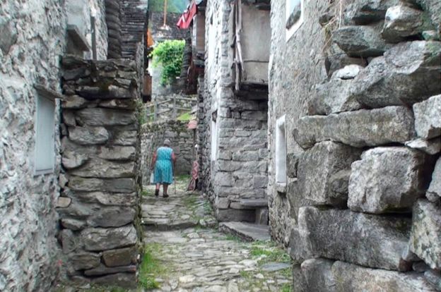 Old lady in a Corippo street