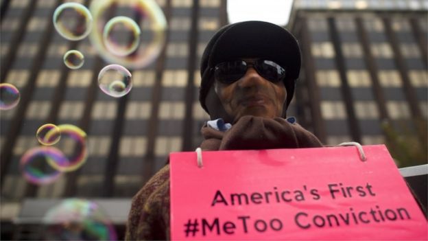 Protester holding sign saying America's First #MeToo Conviction