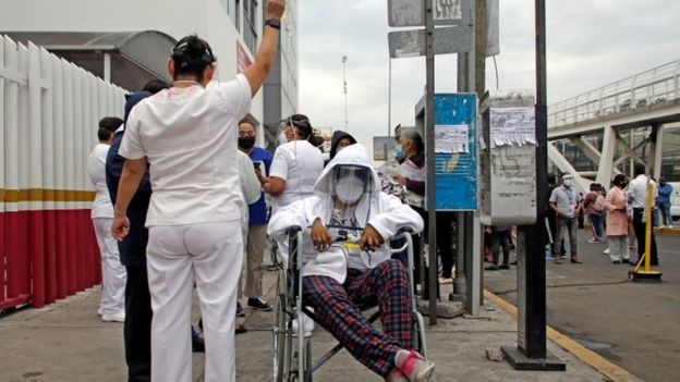 Patients are evacuated from a hospital after hearing the seismic alert in Puebla Mexico