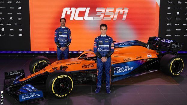 Daniel Ricciardo and Lando Norris with McLaren's car for the 2021 season