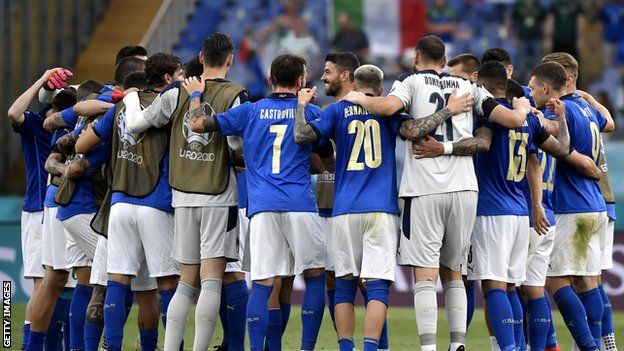 Italy players celebrate their win over Wales