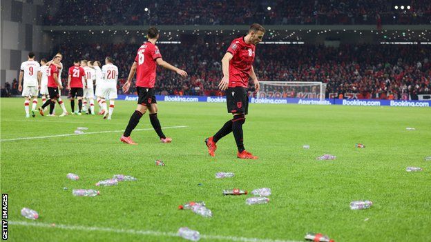 Bottles are thrown on to the pitch
