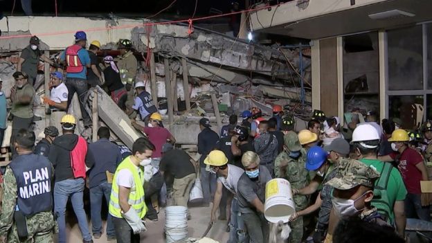 Rescue teams looking for people trapped in the rubble at the Enrique Rebsamen elementary school in Mexico City on September 19, 2017