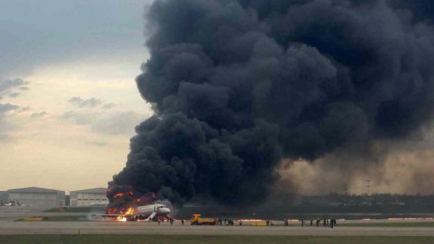 Large fire and smoke engulfs the aircraft