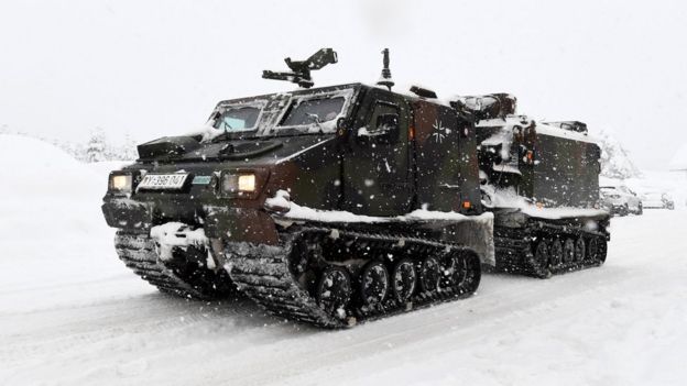 A track vehicle of the German armed forces Bundeswehr drives through the snow to supply the cut off Buchenhoehe settlement area in Berchtesgaden, southern Germany, on January 10, 2019