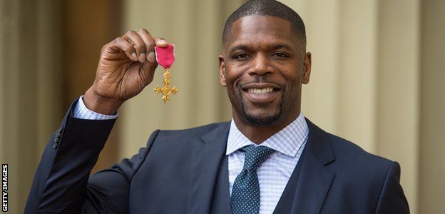 Mark Prince shows off his OBE