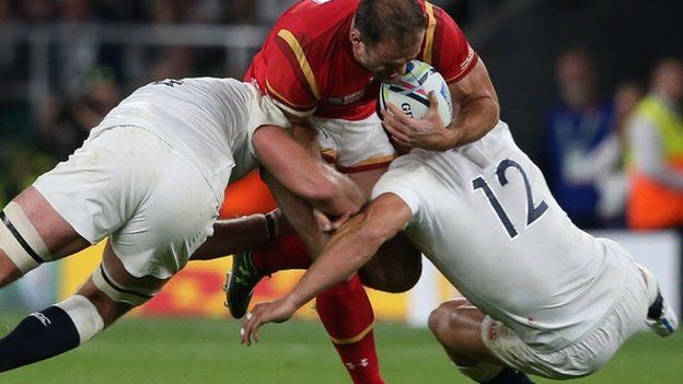 Jamie Roberts clashes with Sam Burgess during Wales' game against England in the 2015 Rugby World Cup