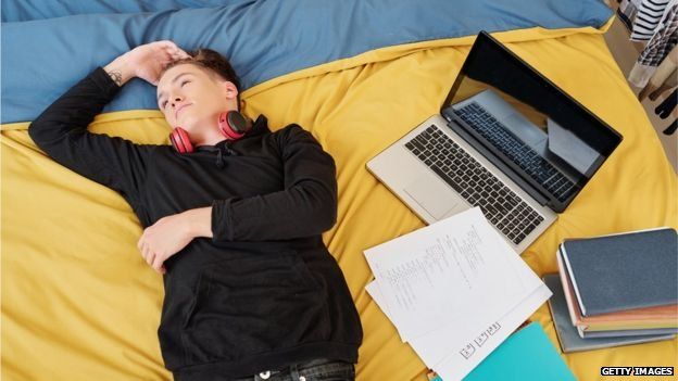 Student pictured alone in her room