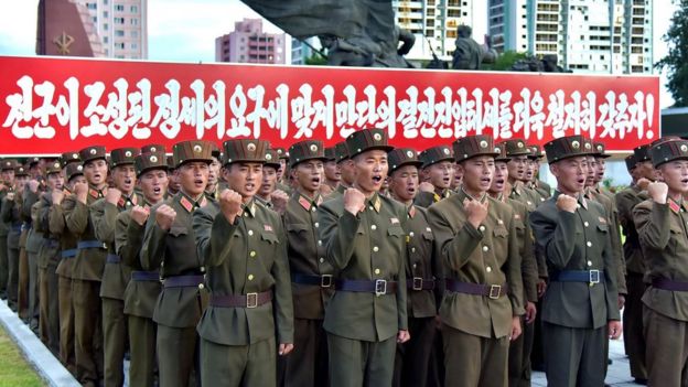 Picture released by KCNA on August 11, 2017 shows service personnel at a rally in Pyongyang