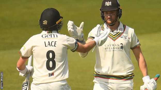 Tom Lace and James Bracey celebrate Gloucestershire's win against Somerset