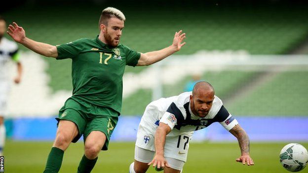 Republic of Ireland striker Aaron Connolly battles with Finland's Nikolai Alho