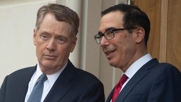 US Trade Representative Robert Lighthizer (L) speaks with Steven Mnuchin, United States Secretary of the Treasury, as they wait for Chinese Vice Premier Liu He to arrive at the the Office of the United States Trade Representative for tariff negotiations in Washington DC on May 9, 2019