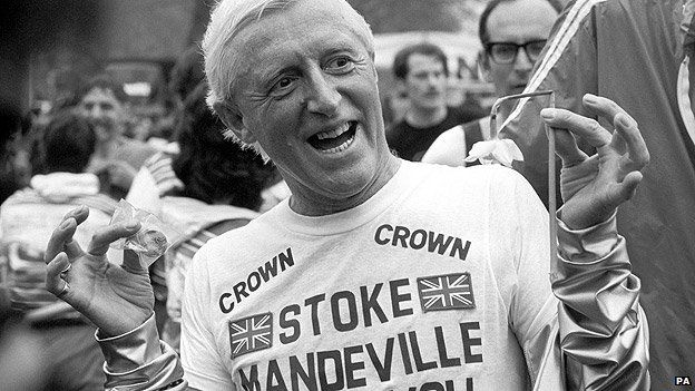 Jimmy Savile wearing a Stoke Mandeville Hospital t-shirt after running a marathon in aid of the hospital in 1981