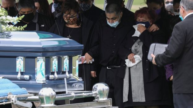Family members of meat packing plant employee Saul Sanchez attend his funeral after he died of coronavirus in Greeley, Colorado