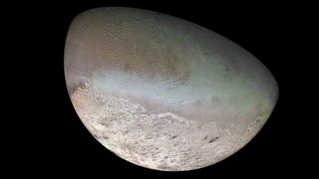 Image of a moon with a mottled surface like a cantaloupe melon