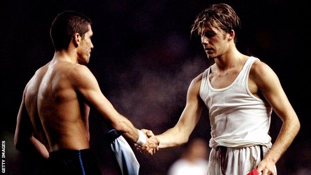 Diego Simeone and David Beckham swap shirts