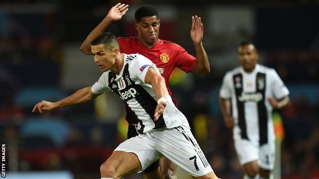Rashford challenges Ronaldo during Manchester United's Champions League game against Juventus in 2018