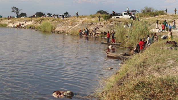 People on river bank