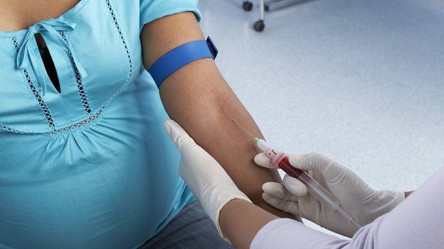 Pregnant woman having a blood test