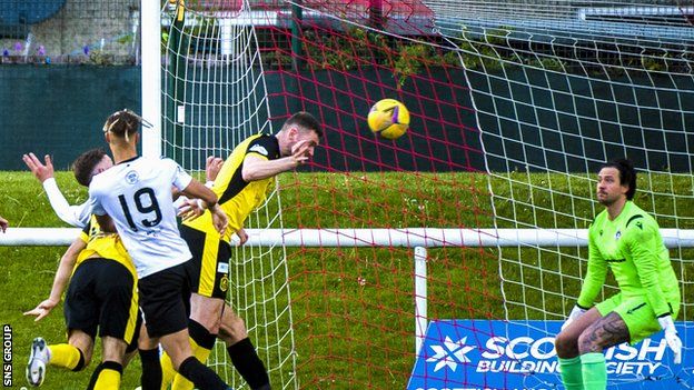 Morgyn Neill powers in a header from a Ross Forbes cross to give Dumbarton a two-goal cushion