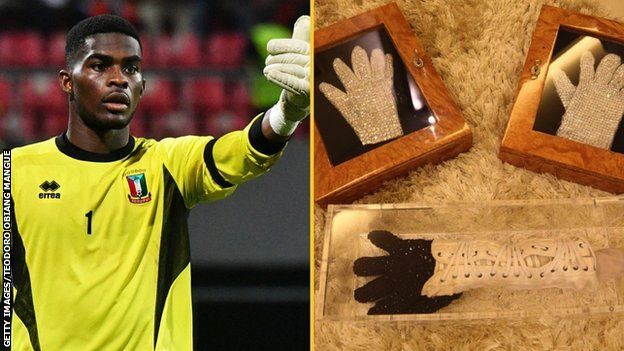 Equatorial Guinea goalkeeper Jesus Owono and gloves previously owned by Michael Jackson