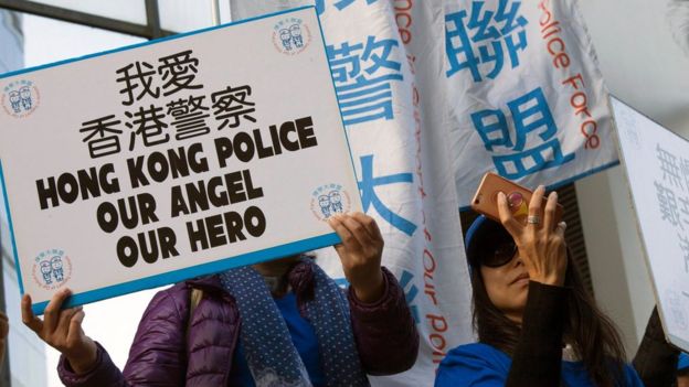 Hong Kong Police supporters gather outside Wan Chai District Court to show their support for seven police officers charged with the actual and grevious bodily harm and common assault of human rights activist Ken Tsang during Hong Kong