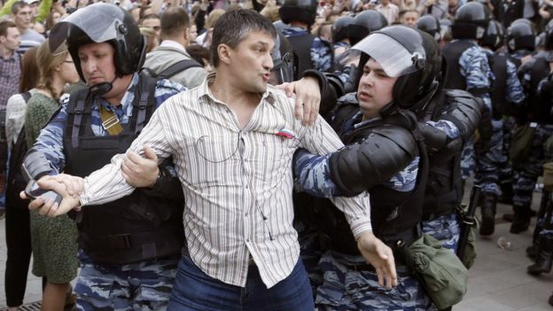 Police detain a participant of an unauthorised opposition rally in Tverskaya Street in central Moscow, Russia, 12 June 2017