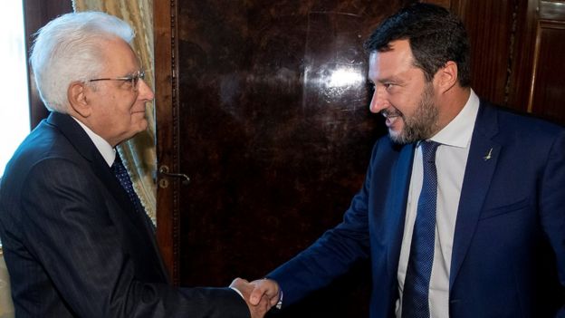 Italys President Sergio Mattarella shakes hands with League leader Matteo Salvini in Rome