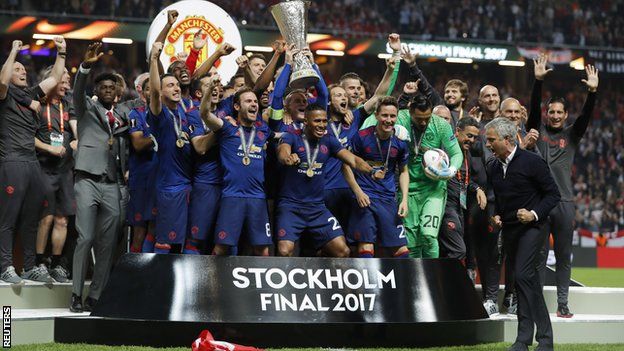 Manchester United lift the Europa League trophy