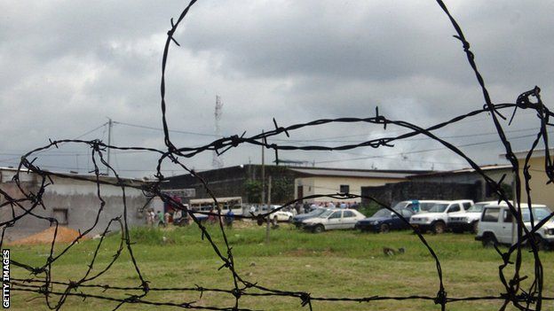 Libreville's central prison viewed through barbed wire
