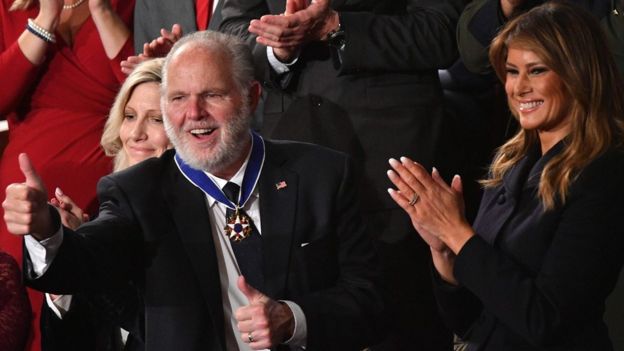 Rush Limbaugh (L) smiles after being awarded the Medal of Freedom by First Lady Melania Trump