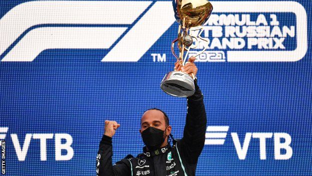 Lewis Hamilton celebrates after winning 2021 Russian Grand Prix