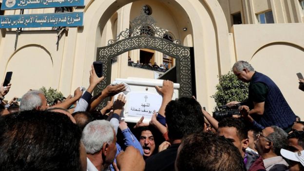 Mourners carry a coffin during the funeral of Coptic Christians who were killed in an attack, in Minya, Egypt November 3, 2018