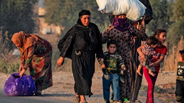 Civilians flee bombardment in Ras al-Ain, 9 October