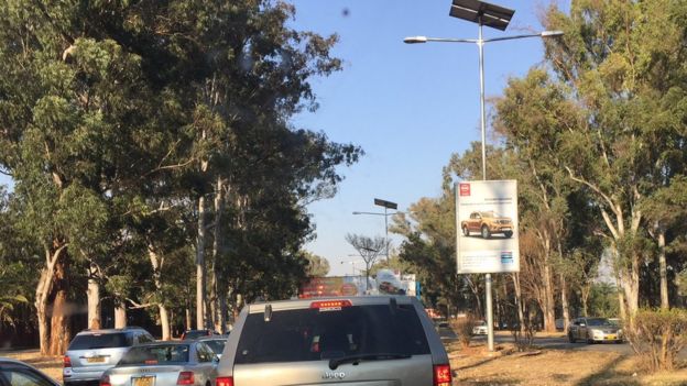A street in Harare showing a solar-powered street lamp