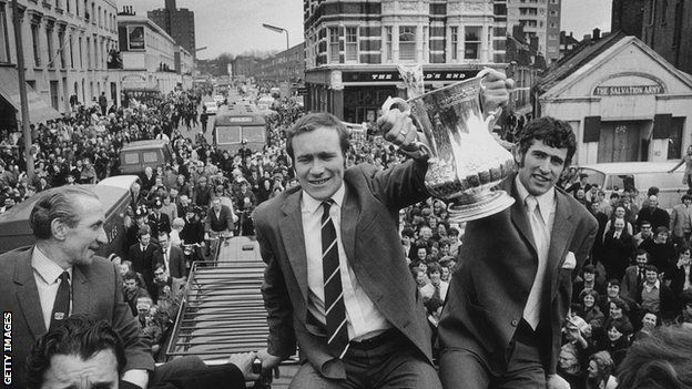 Chelsea players Ron Harris (left) and Peter Bonetti hold the trophy aloft.