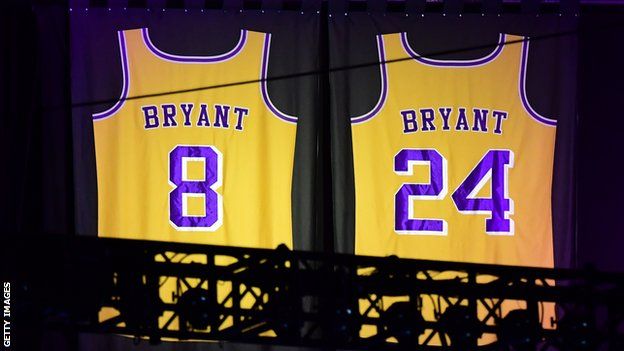 The number 8 and number 24 retired Kobe Bryant Los Angeles Lakers jerseys hanging in the rafters of the Staples Center