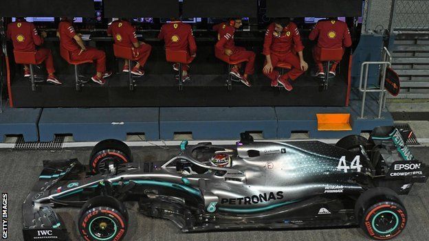 Hamilton drives past Ferrari