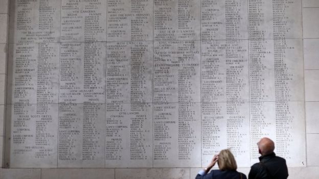 People look at the names of some of fallen soldiers on the Menin Gate in Ypres